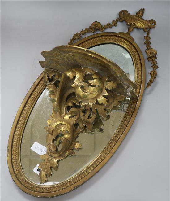 A gilt mirror and a bracket